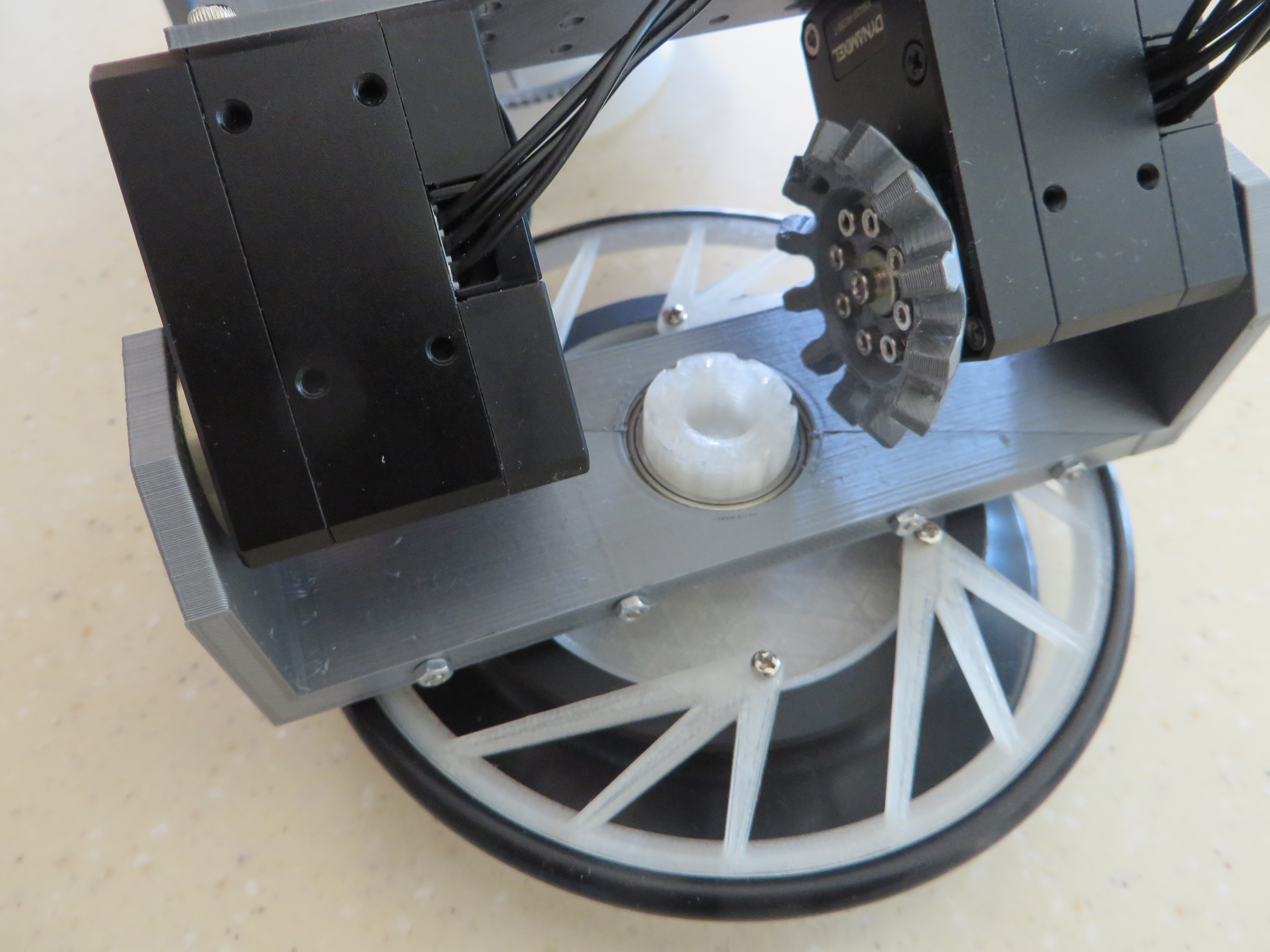 Robot leg with vacuum suction cup and wheel